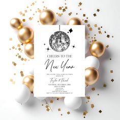 a new year's eve party with gold and white balloons