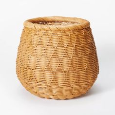 a wicker basket is shown on a white background