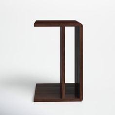 a wooden table with a shelf on the side