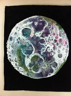 an abstract painting of the moon on a black background