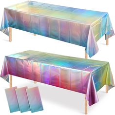 the table cloths are multicolored and have wooden legs