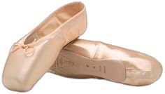 pair of ballet shoes on white background