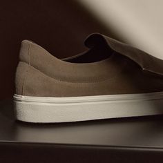 Our Coastal Suede Slip On is made with leather with vulcanized rubber outsole, adding flexibility and stability. Style detail includes leather lining. Additional Information:• 100% Leather • Leather lining, Removable Leather Insole • Imported Suede Slip-on Sneakers With Leather Sole And Round Toe, Sporty Leather Slip-ons With Vulcanized Sole, Modern Slip-ons For Streetwear, Sporty Leather Slip-ons For Streetwear, Modern Suede Slip-on Sneakers, Brown Leather Modern Slip-on Sneakers, Modern Brown Leather Slip-on Sneakers, Comfortable Slip-on Sneakers With Leather Sole, Streetwear Slip-on Sneakers With Removable Insole