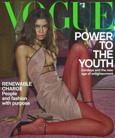 a magazine cover with a woman laying on the floor