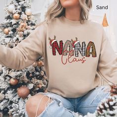 Get into the festive spirit with our Nana Claus Family Matching Christmas Sweatshirt! This cozy and stylish sweatshirt is perfect for creating fun holiday memories. Whether you're gathering for a family Christmas photo or just celebrating together, this sweatshirt will make Nana feel extra special. With its merry and bright design, it's a cute Xmas addition to your family holiday attire. Looking for more family Claus options? Check out our other listings for matching Family Christmas shirts feat Matching Family Christmas Shirts, Matching Christmas Outfits, Family Matching Christmas, Bright Design, Holiday Attire, Christmas Family Photos, Xmas Sweater, Xmas Shirts, Sweatshirt Cute