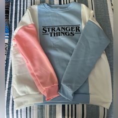 Stranger Things Multicolored Crewneck Sweatshirt! Is Size L But Fits Like A Medium. Never Worn Before! All Clothing Is Washed And Ironed Before Shipment! Please Let Me Know If You Have Any Questions! Spring Crew Neck Sweatshirt With Contrast Color, Trendy Crew Neck Sweatshirt With Contrast Color, Pink Color Block Sweatshirt For Spring, Pink Color Block Cotton Sweater, Pink Long Sleeve Top With Contrast Color, Pink Crew Neck Sweater With Contrast Color, Trendy Pink Color Block Sweatshirt, Pink Contrast Color Crew Neck Sweater, Pink Casual Tops With Contrast Color