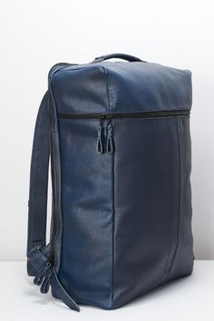 Banteng Travel Backpack · Navy by Capra Leather Commuter Rectangular Travel Bag With Functional Pockets, Rectangular Commuter Travel Bag With Functional Pockets, Commuting Backpack Travel Bag With Zipper Closure, Functional Laptop Backpack For Trips, Functional Backpack With Zipper Pocket For Trips, Functional Leather Laptop Bag For Trips, Commuting Backpack With Luggage Sleeve, Modern Laptop Backpack For Trips, Commuting Backpack Travel Bag With Luggage Sleeve