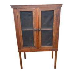 an old wooden cabinet with glass doors