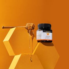 a jar of honey sitting on top of a table