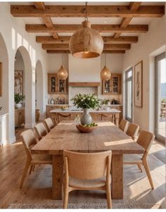 a large wooden table sitting in the middle of a kitchen