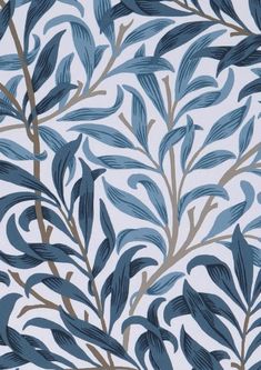 a blue and white wallpaper with leaves on it