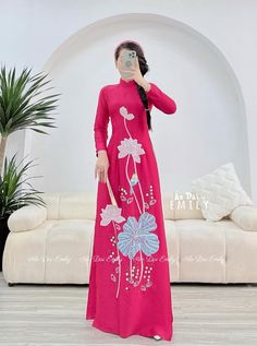 🌻Material: Lụa 🌻Stretchy level: 2/10 🌻 The measurement of this ao dai (long dress) is in Vietnamese size (American size tends to be bigger for the same size). Please LOOK AT THE SIZE CHART CAREFULLY BEFORE ORDERING. There might have some chalk writings on the fabric due to making process. These marks can be washed away easily. 🌻🌻No returns or exchanges Buyer can contact seller about any issues with an order. 🌸 Follow us Facebook/aodaiemily www.aodaiemily.com 💜 Thank you very much!💜 Traditional Fitted Ao Dai For Festive Occasions, Traditional Embroidered Ao Dai For Party, Traditional Fitted Pink Ao Dai, Traditional Long Fitted Ao Dai, Traditional Fitted Long Ao Dai, Red Embroidered Fitted Ao Dai, Embroidered Long Sleeve Ao Dai For Party, Traditional Fitted Embroidered Ao Dai, Traditional Embroidered Ao Dai