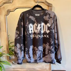 For Those About To Rock, We Suggest Wearing This Sweatshirt. Featuring "Ac/Dc Back In Black" Text Design In A Unique Acid-Wash Print (Pattern May Vary). New 25 Bust X 26 Length Cotton/Polyester Blend New Without Tags Soft-washed Black Tops For Fall, Soft-washed Black Top For Fall, Black Crew Neck Soft-washed Sweatshirt, Black Soft-washed Crew Neck Sweatshirt, Casual Black Distressed Sweatshirt, Trendy Black Distressed Sweatshirt, Fall Distressed Black Sweatshirt, Black Cotton Sweatshirt Soft-washed, Black Soft-washed Cotton Sweatshirt