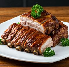 two pieces of meat on a plate with parsley garnishes and sauce