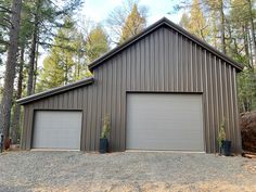 two garages in front of trees and gravel