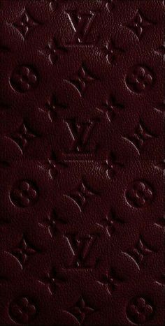 an image of a red leather texture with the word louis vuitton on it