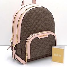 Michael Kors Jaycee Medium Backpack Brown / Pink Signature Color Backpack Logo-Print Canvas 89.4% Coated Canvas/9.6% Polyester/1% Polyurethane Trim: 60% Polyurethane /20% Polyester/20% Cotton Gold-Tone Hardware 8.75”W X 12”H X 4.25”D Exterior Details: Front Zip Pocket Interior Details: Back Zip Pocket, Tech Compartment, Front Slip Pocket Lining: 100% Polyester Zip Fastening Imported Luxury Pink Bags With Logo, Designer Pink Leather Backpack, Designer Pink Standard Backpack, Luxury Pink Standard Backpack, Luxury Pink Backpack, Michael Kors Pink Travel Bag, Michael Kors Pink Travel Backpack, Michael Kors Pink Backpack For Everyday, Pink Michael Kors Backpack For Travel