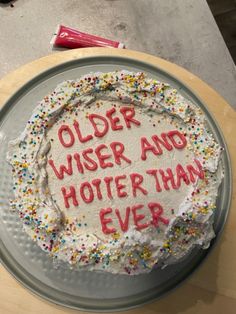 a birthday cake that says older wise and hotter than ever