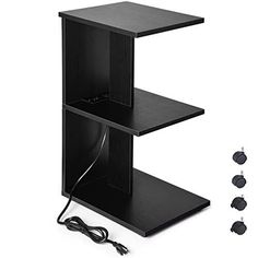 two black shelves with wires and plugs attached to the sides, one on top of the other