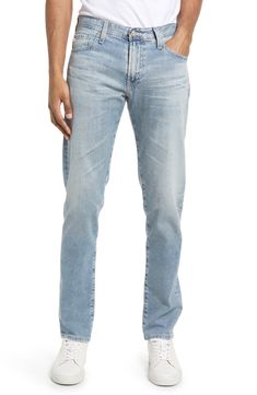 A well-worn wash puts a classic stamp on slim-cut jeans shaped from stretchy cotton denim. 33" inseam; 13" leg opening; 10 1/4" front rise; 15" back rise (size 32) Zip fly with button closure Five-pocket style 98% cotton, 2% polyurethane Machine wash, tumble dry Imported Men's Clothing Straight Washed Blue Jeans, Classic Washed Blue Jeans With Five Pockets, Washed Blue Straight Jeans, Classic Washed Blue Jeans With Standard Cut Leg, Straight Washed Blue Rigid Denim Jeans, Slim Fit Jeans With Five Pockets For Everyday, Light Wash Fitted Straight Jeans, Fitted Light Wash Straight Jeans, Classic Faded Jeans With Five Pockets