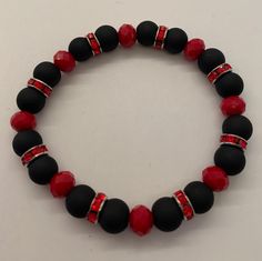 "Handmade Elegua Inspired Bracelet made with high quality glass beads. Elegua is the most important of the orishas in santeria. He is the key to any of our religious practices, for without Elegua's blessings nothing can proceed. Colors: Red and Black Number: 3 Item made to order. Will measure approximately 7.5\" unless you request a different size. *All items will be saged prior to shipping *Please visit my store each week for new items" Red Spiritual Bracelet With Black Beads, Spiritual Beaded Bracelets With Large Beads, Adjustable Spiritual Stretch Bracelet With Large Beads, Spiritual Stretch Bracelet With Large Beads For Gifts, Adjustable Crystal Bracelet With Large Beads As Gift, Adjustable Spiritual Crystal Bracelet With Large Beads, Adjustable Large Beads Rosary Bracelet As Gift, Adjustable Spiritual Stretch Bracelet With Faceted Beads, Spiritual Stretch Bracelet With Spacer Beads Gift