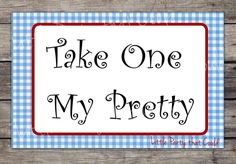 a sign that says take one my pretty with the words in black and red on it