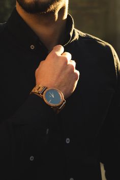 a man with a watch on his wrist