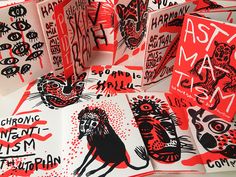 several red and black greeting cards with cats on them