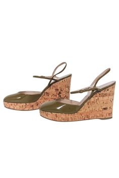 Step into summer with these unique cork wedges from Yves Saint Laurent. Combining a playful style with a boho flair, these round-toe cork wedges are the perfect summer staple. Pair them with a floral dress and oversized sunglasses for a fun and fashionable look! Size 5 (IT 35) Made in Spain Patent leather upper Leather lining Cork wedge Rubber sole Buckle ankle strap Rounded toe Minor blemish on upper Heel height 4" Chic Cork Wedge Sandals For Spring, Spring Cork Heels With Round Toe, Summer Cork Wedge Heels, Brown Cork Wedge Sandals For Summer, Summer Brown Cork Wedge Sandals, Chic Cork Heels For Spring, Spring Cork Wedge Sandals With Round Toe, Cork Heels With Wooden Heel And Round Toe, Cork Wedges