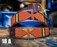 The Belts are made from ethically sourced leather in Kenya. The collars are then hand beaded by Maasai women artisans from my Village in Kajiado who have mastered the art. The hardware is made from 100% recycled brass. TO MEASURE CORRECTLY Our measurements are from the tip of the Buckle of the Collar to the second hole after the beaded section. General Belt SizeNumerical Belt SizeWaist Measurement (inches) XS 30 26.5-28 S 32 28.5-30 M 34 30.5-32 M 36 32.5-34 L 38 34.5-36 L 40 36.5-38 XL 42 38.5- Adjustable Brown Traditional Belt Buckles, Traditional Adjustable Leather Belt, Traditional Adjustable Brown Belt Buckles, Artisan Brown Embroidered Belt, Handmade Brown Belts For Festival, Traditional Leather Belts For Festivals, Traditional Handmade Brown Belt Buckles, Adjustable Artisan Embroidered Belt, Artisan Embroidered Adjustable Belts