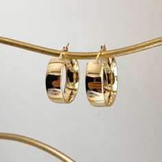 14KT yellow gold shiny + wide round hoop earrings. Yummy, chunky gold hoops in a mid, round size. Length: 25mm Width: 23mm Thickness: 8mm Weight: 3.63 grams Stamped 14K Latch back closure Solid 14K Luxury Round Brass Hoop Earrings, Cheap Gold Plated Round Hoop Earrings, Luxury Classic Brass Hoop Earrings, Cheap Vintage Round Hoop Earrings, Luxury Brushed Finish Round Jewelry, Cheap Gold Round Hoop Earrings, Gold Hoop Earrings 2022, Luxury Gold-plated Round Hoop Earrings, Cheap Trendy Yellow Gold Hoop Earrings