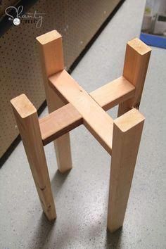 a wooden chair sitting on top of a table