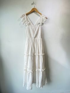 Cleobella White Eyelet Lace Dress! Adorable flutter sleeves and has pockets! Skirt is fully lined. 100% organic cotton. Made in India. No size tag but would best fit a small, please refer to measurements. In excellent condition. Approx. Measurements: Underarm to Underarm: 15.5" Waist: 28-34" Length: 49" Eyelet Lace Dress, Ace And Jig, Raquel Allegra, Magnolia Pearl, White Eyelet, Eyelet Lace, Flutter Sleeves, Ulla Johnson, Vivienne Westwood