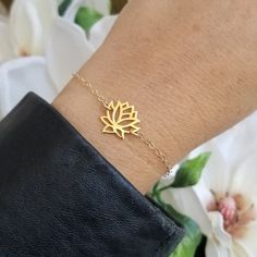 Minimal and Simplistic Style!A meaningful gold lotus flower bloom sits in the center with sparkling Gold Filled chain encircling the wrist. Solid lobster clasp. Your choice of length or you can order it to be adjustable making it easier for gift giving.Just like the Lotus, we too have the ability to rise from the mud, bloom out of the darkness and radiate into the world.All jewelry includes complimentary gift packaging.At Fabulous Creations, all our jewelry is handcrafted in the USA, inspired by Simple Adjustable Jewelry As A Gift, Gold Bracelets With Simple Design For Gift, Everyday Gold Jewelry In Flower Shape, Minimalist Bracelets With Flower Charm As Gift, Dainty Gold Flower Shaped Bracelets, Gold Spiritual Bracelets As A Gift For Her, Gold Plated Flower Shaped Bracelets As Gifts, Minimalist Adjustable Flower Jewelry, Adjustable Hypoallergenic Flower-shaped Jewelry