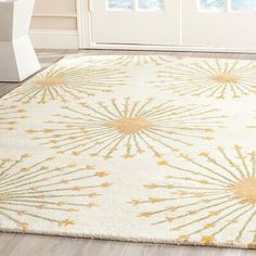 a white and gold rug with fireworks on it