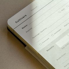 a close up of a book on a table with a calculator next to it