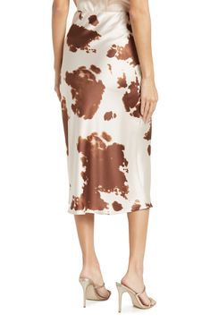 Get ready for your next festival with this trendy cow print midi skirt that features a satin construction. Fixed waist Cowl print Satin construction Midi length Machine wash cold Imported Model stats: 5'10", 32" bust, 25" waist, 36" hip. Model is wearing size S. Cow Print Skirt, Brown Cow Print, Cow Prints, Cow Outfits, Brown Cow, Brown Satin, Printed Midi Skirt, Midi Length Skirts, Glam Looks