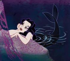 an animated image of a mermaid swimming in the water