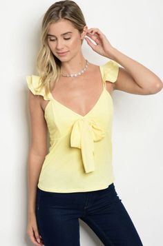 On Trend Yellow Lettuce Edge Ruffle Blouse Scooped Neck Ruffle Cap Sleeve with a Front Bow Detail 95% Polyester 5% Spandex - Lined Top Junior Sizes - Small, Medium, Large - Fits True to Size Wash in Cold Water Dry Low heat Made in the USA Black Ruffle Top, Dressy Shirts, Womens Tops Dressy, Dressy Blouse, Bow Blouse, Junior Outfits, Yellow Fashion, Neck Ruffle, Dressy Tops