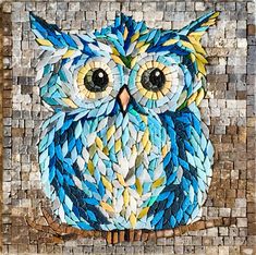 an owl made out of small pieces of paper and colored glass beads on a mosaic tile background