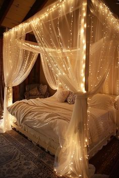 a bed with lights on it and a canopy over the headboard is made up