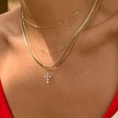 The Genevieve Necklace is a classic, dainty piece. Made with a cubic zirconia gem cross pendant that sparkles and catches the eye, this necklace is perfect for day to night wear. Designed with a non-tarnishing curb and twist chain, this light weight necklace looks luxury without the heavy weight. Cross Pendant Chain Necklace, Delicate Chain Necklace With Cross Pendant, Dainty Cross Jewelry In Cubic Zirconia, Dainty Cubic Zirconia Cross Jewelry, Dainty Cross-shaped Cubic Zirconia Jewelry, Dainty Cross Necklace In Cubic Zirconia, Dainty Cubic Zirconia Cross Necklace, Cubic Zirconia Cross Necklace With Clavicle Chain, Light Weight Necklace