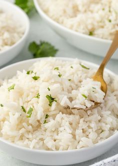 white rice is being spooned into a bowl