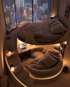 a bedroom with a circular bed in front of a window overlooking the city at night