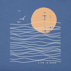 a blue shirt with an orange sun over the ocean and birds flying in the sky