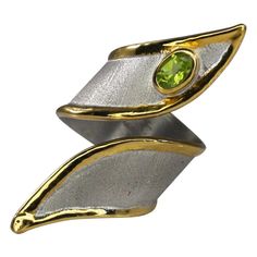 This is Yianni Creations Artisan Ring from Midas Collection 100% Handmade from Fine Silver 950 purity of silver featuring 0.50 Carat Peridot. The ring is crafted using ancient techniques of craftsmanship - brushed texture and nature-inspired liquid edges. The ring is plated with Palladium to resist the elements and the edges with a thick overlay of Pure Gold. This ring adjusts in size due to its design, meaning you can wear it on different fingers each day. Contact us for this design in differen Silver Peridot Rings With Polished Finish, Silver Peridot Rings In Fine Jewelry Style, Silver Peridot Rings Fine Jewelry, Silver Peridot Ring For Formal Occasions, Formal Silver Peridot Rings, Birthstone Band, Ancient Techniques, Rings Adjustable, 24 Karat Gold