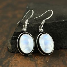 Natural Rainbow Moonstone Gemstone 925 Sterling Silver Earring Jewelry. Earring made by Natural Rainbow Moonstone Gemstone with pure 925 sterling silver. The unique design jewelry Earring has been fashioned out of 925 sterling silver and promises to be comfortable wear at all times. This Jewelry can be a perfect gift for your loved ones and one of a kind design makes this thing perfect for engagement gift, wedding gift, marriage anniversary gift and birthday gift. Rainbow Moonstone Earring - Ova Silver Sterling Crystal Earrings With Natural Stones, Silver Crystal Earrings With Natural Stones, White Sterling Silver Oval Earrings, White Oval Sterling Silver Earrings, Silver Crystal Earrings With Natural Stones, Round Shape, Silver Moonstone Earrings For Anniversary, Silver Round Crystal Earrings With Natural Stones, White Round Earrings With Natural Stones, Silver Earrings With Moonstone And Natural Stones