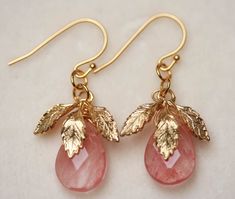 "Pale Pink Quartz Gold Leaf Earrings From my Garden Collection , a lovely faceted pink quartz briolettes staged below gold plate leaves. Dangles from a gold plate french wire or a elegant lever back , you choose Hangs 1.5\" Pink quartz briollete is a generous size 10 x 14mm H A N D M A D E * We hand make all pieces in our Water Mill New York studio * We source eco friendly packaging and materials, including recyclable mailers! FREE BOX AND WRAP ON EVERY ORDER P R O D U C T I O N ∙ T I M E S All Pink And Gold Earrings, Earrings Strawberry, Cherry Quartz, Water Mill, Gold Leaf Earrings, Eco Friendly Packaging, Pink Leaves, Earrings Pink, Strawberry Quartz