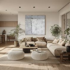 a living room filled with furniture and a painting on the wall