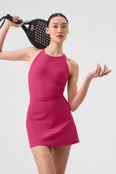 It’s a fresh ’90s spin on your favorite tennis dress, complete with a high neck, a fitted waist, and a short, swingy hem. But that’s not even the best part—see the open back and the chic trio of straps? Practical details include a built-in shelf bra with removable cups and built-in shorts with pockets for holding a tennis ball or two. Add some sneakers and get ready to serve. Active Dresses, Sport Fits, Sports Outfits, Pink Activewear, Gray Accessories, Tank Top Bras, Womens Capris, Tennis Dress, Pink Summer